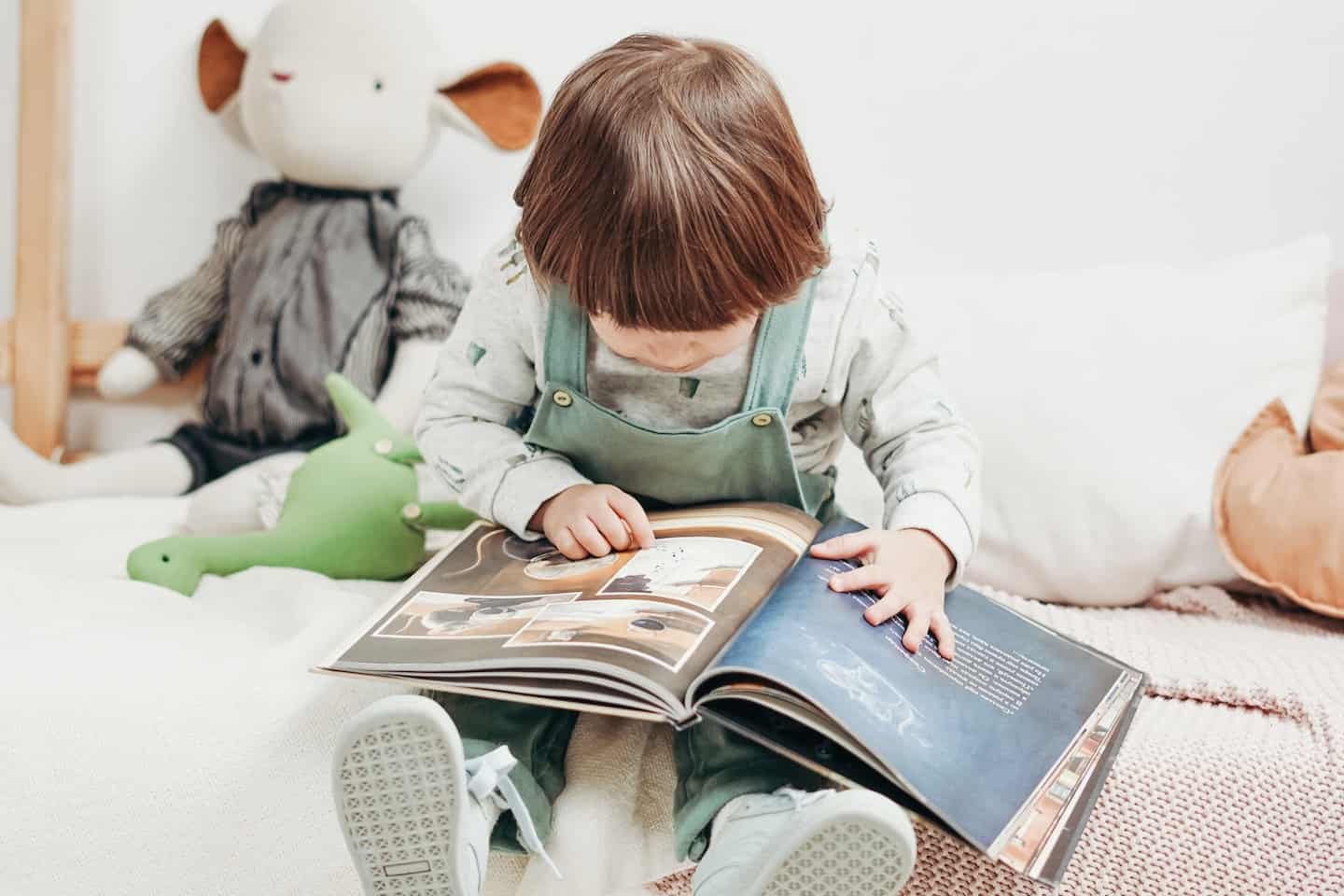 intelligent toddler reading a book