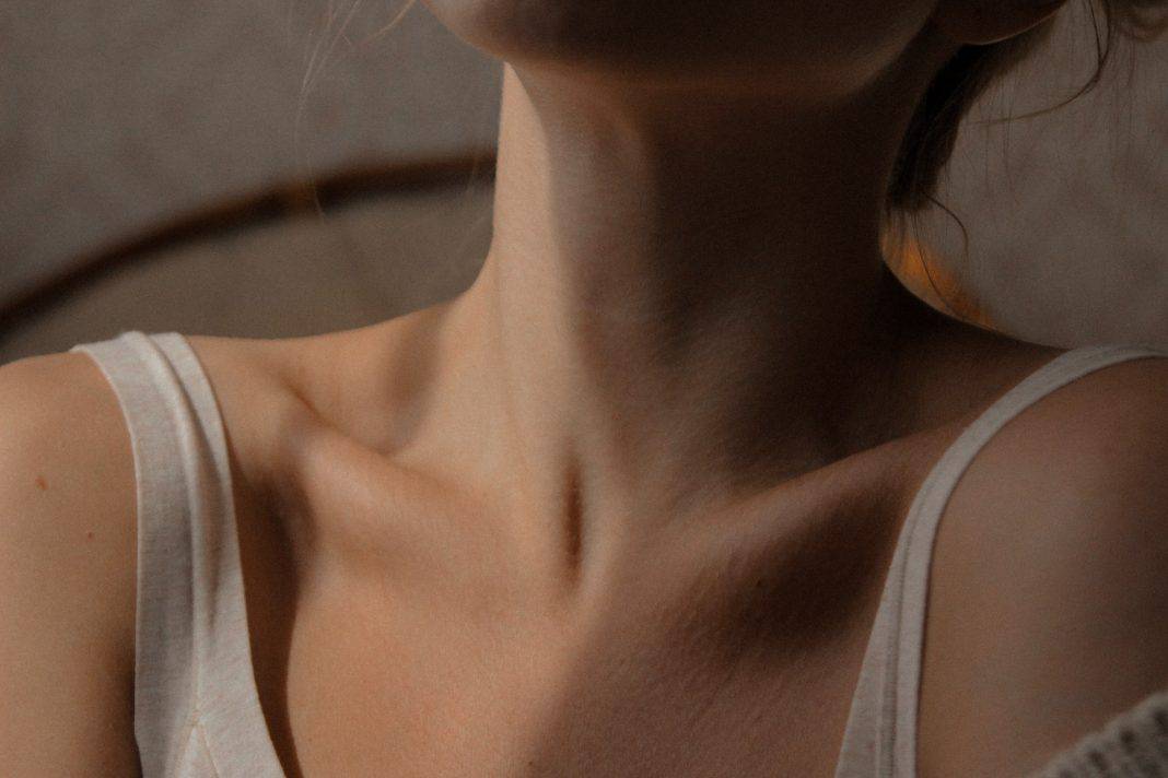 Close up shot of a woman's neck and collar bones