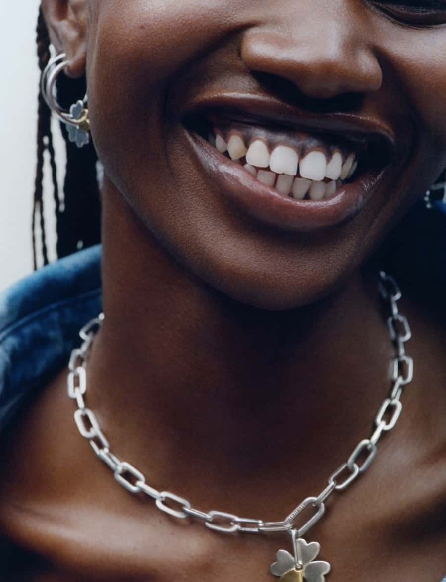 Women smiling with necklack
