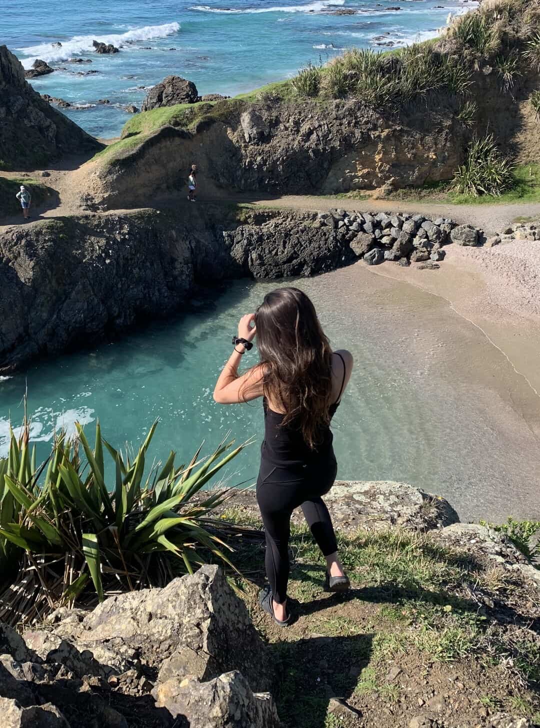 woman enjoying the view from a sea cliff